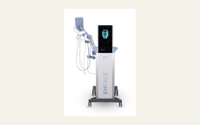 The EMFACE console on castors, with its touchscreen and treatment applicators on the arm